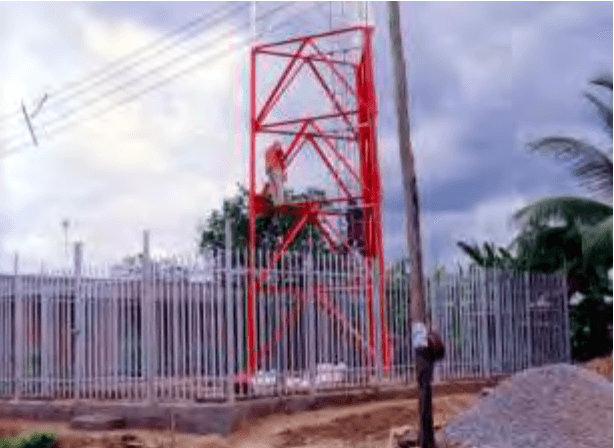 JINL team erecting a telecom tower structure on site